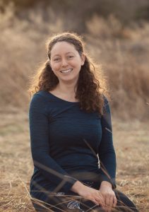 portrait of Chantal outside in a field