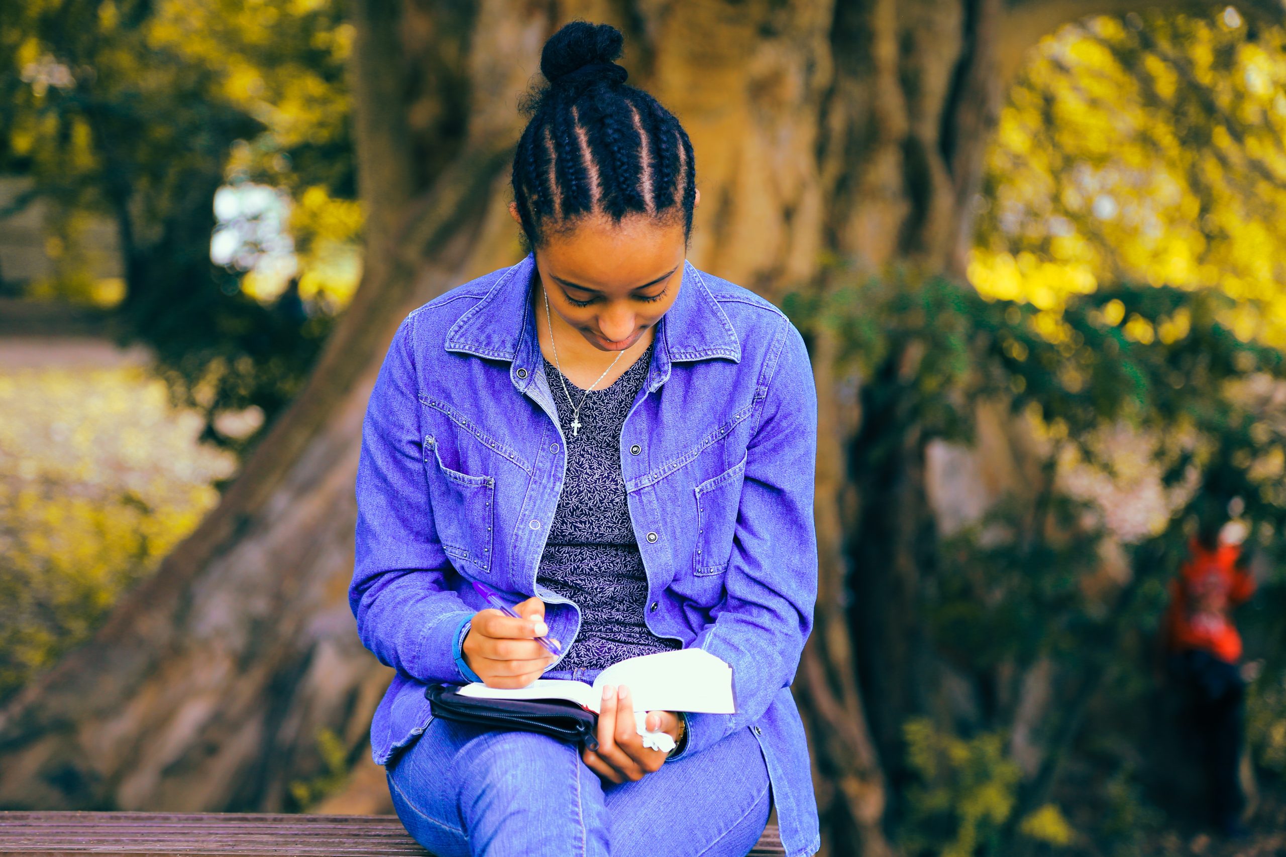 black girl writing affirmations for teen girls